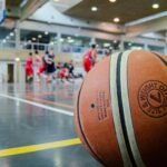 Captivating indoor basketball scene with players actively engaged in a game.